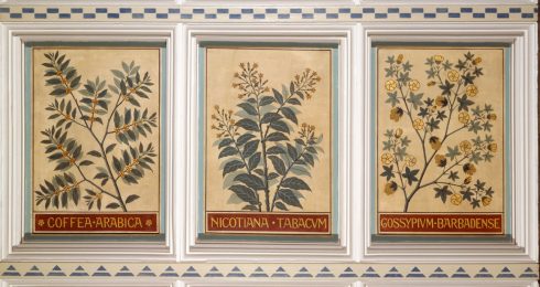 Gilded panels in the Hintze Hall showing coffee, tobacco and cotton plants 